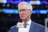 Mike Breen holds his mic up.