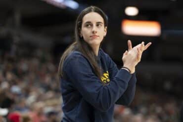 Caitlin Clark claps hands.