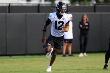 Travis Hunter runs in practice.