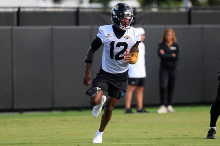 Travis Hunter runs in practice.