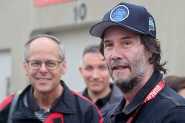 Keanu Reeves stares on the track.