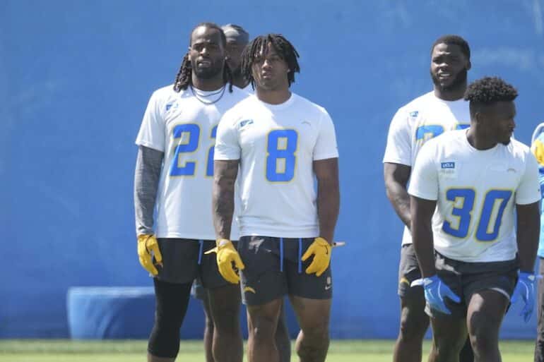 Los Angeles Chargers running backs Najee Harris (22), Omarion Hampton stand at practice.