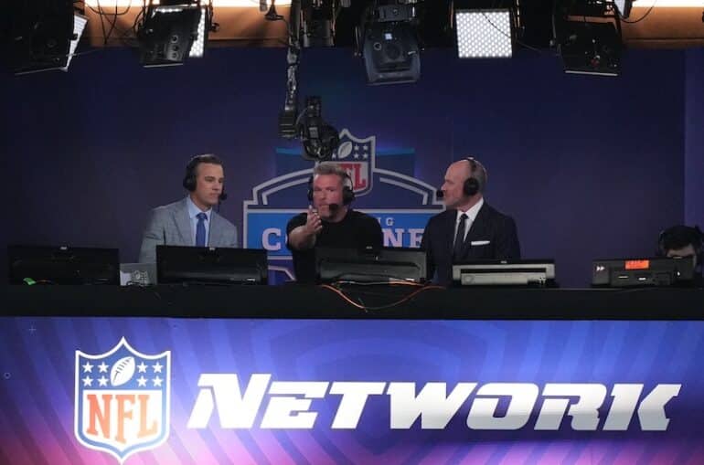 NFL Network hosts Daniel Jeremiah sits with two other people.