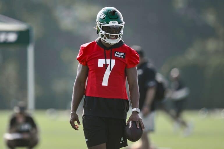 Justin Fields holds the ball.