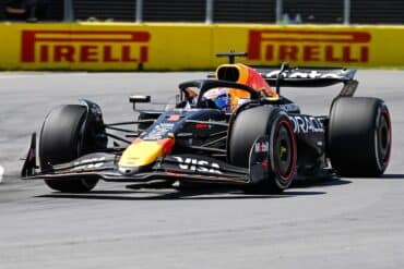 Red Bull Racing driver Max Verstappen driving a car.