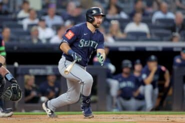 Cal Raleigh swings the bat.