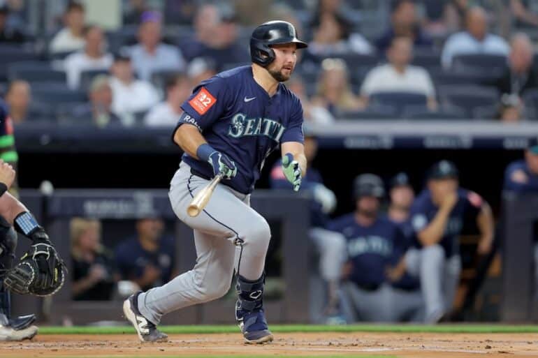 Cal Raleigh swings the bat.