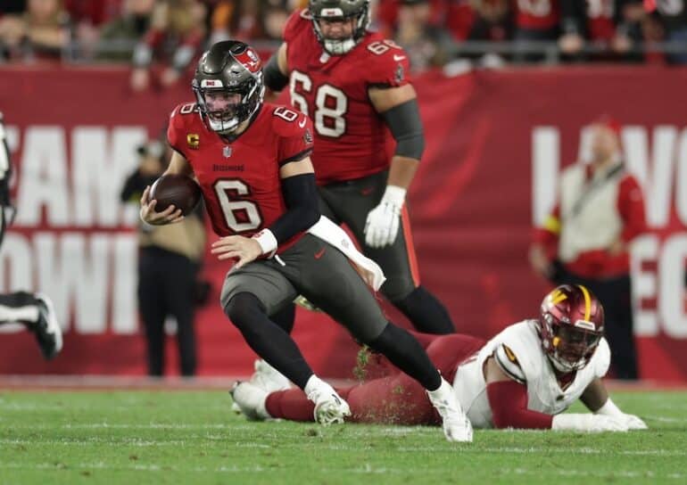 Tampa Bay Buccaneers quarterback Baker Mayfield runs the ball.
