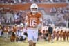 Texas Longhorns quarterback Arch Manning runs on the field.