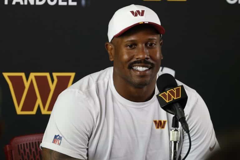Von Miller sitting at the table.