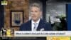 Alan Hahn looks at the screen.