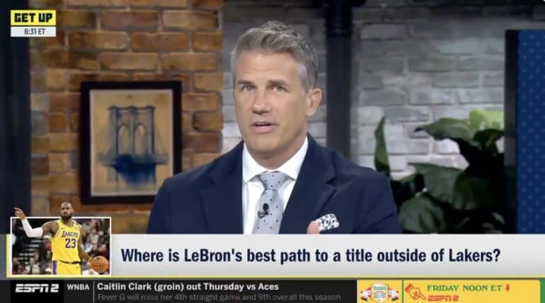 Alan Hahn looks at the screen.