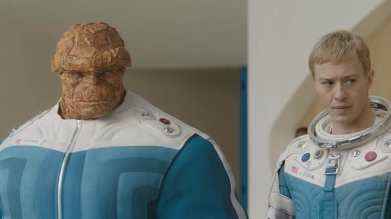 The Thing and Human Torch stare.