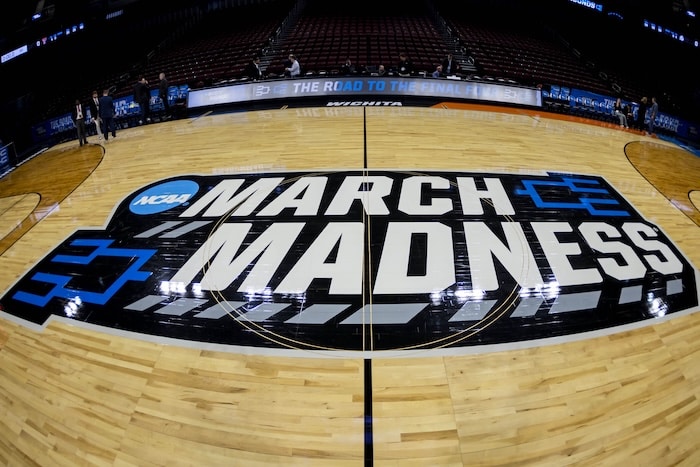 March Madness logo on the court.