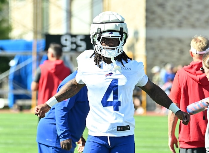 Buffalo Bills running back James Cook stands on the field.
