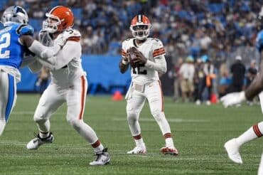 Cleveland Browns quarterback Shedeur Sanders holds the ball.
