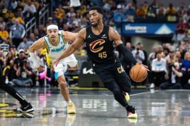 Donovan Mitchell dribbles the ball.