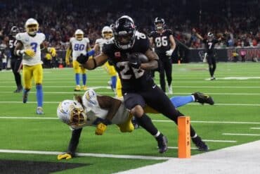 Houston Texans running back Joe Mixon carries the ball.
