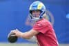 Matthew Stafford readies to throw a ball.