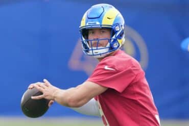 Matthew Stafford readies to throw a ball.