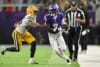 Minnesota Vikings wide receiver Jordan Addison catches and runs the ball.