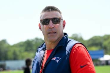 Mike Vrabel stands and stares.