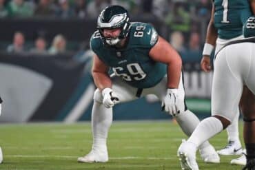 Philadelphia Eagles guard Landon Dickerson puts hands on knees.