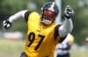 Cam Heyward runs on the field.