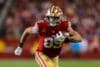 George Kittle runs the ball.