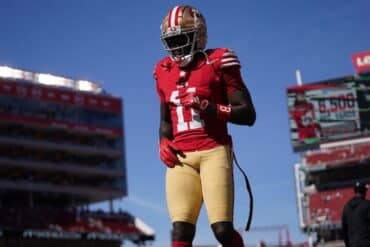 San Francisco 49ers wide receiver Brandon Aiyuk runs on the field.