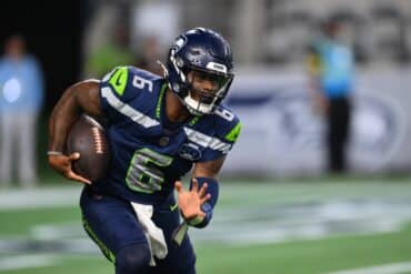 Jalen Milroe runs the ball.
