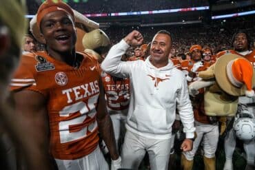 Steve Sarkisian of the Texas Longhorns puts his fist up.