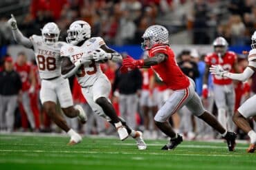 exas Longhorns linebacker David Gbenda (33) and Ohio State Buckeyes tackles.
