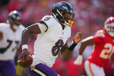 Lamar Jackson runs the ball.