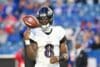 Lamar Jackson throws the ball in the air.
