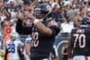 Caleb Williams grabs his pads.