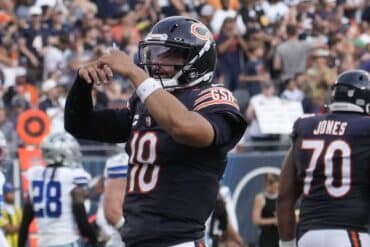 Caleb Williams grabs his pads.
