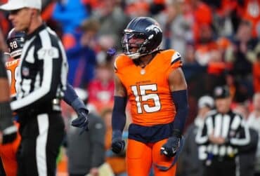 Denver Broncos linebacker Nik Bonitto flexes.