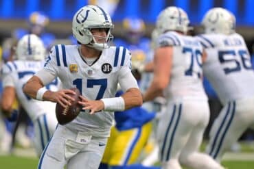 Daniel Jones holds the ball.