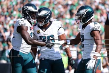 Eagles celebrate in a huddle.