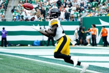 Pittsburgh Steelers running back Kaleb Johnson goes under a ball.