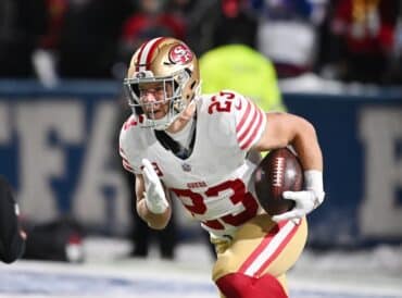 Christian McCaffrey runs the ball.