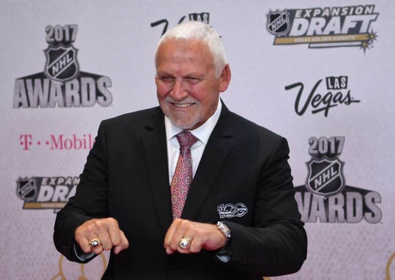 X reacts to the passing of Flyers goalie Bernie Parent