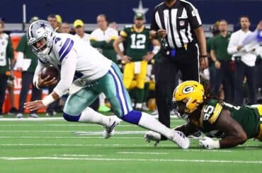 Linebacker Za'Darius Smith tackles Dak Prescott.