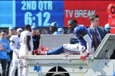 Malik Nabers gets carted off.