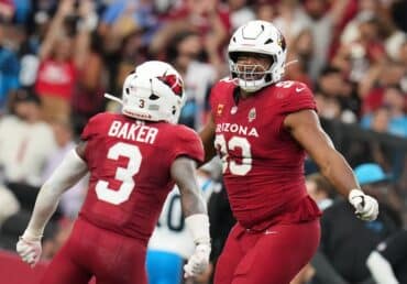 Calais Campbell and Budda Baker celebrate.