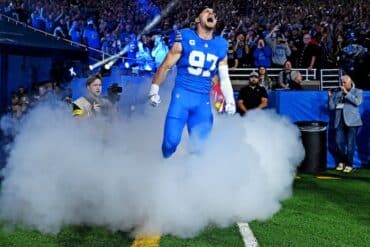 Detroit Lions defensive end Aidan Hutchinson runs.