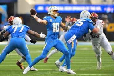 Justin Herbert throws a pass.