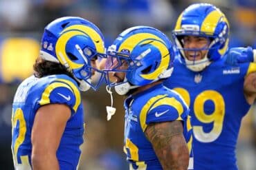 Two Rams' players hit helmets.