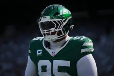 New York Jets defensive lineman Quinnen Williams stands and looks.